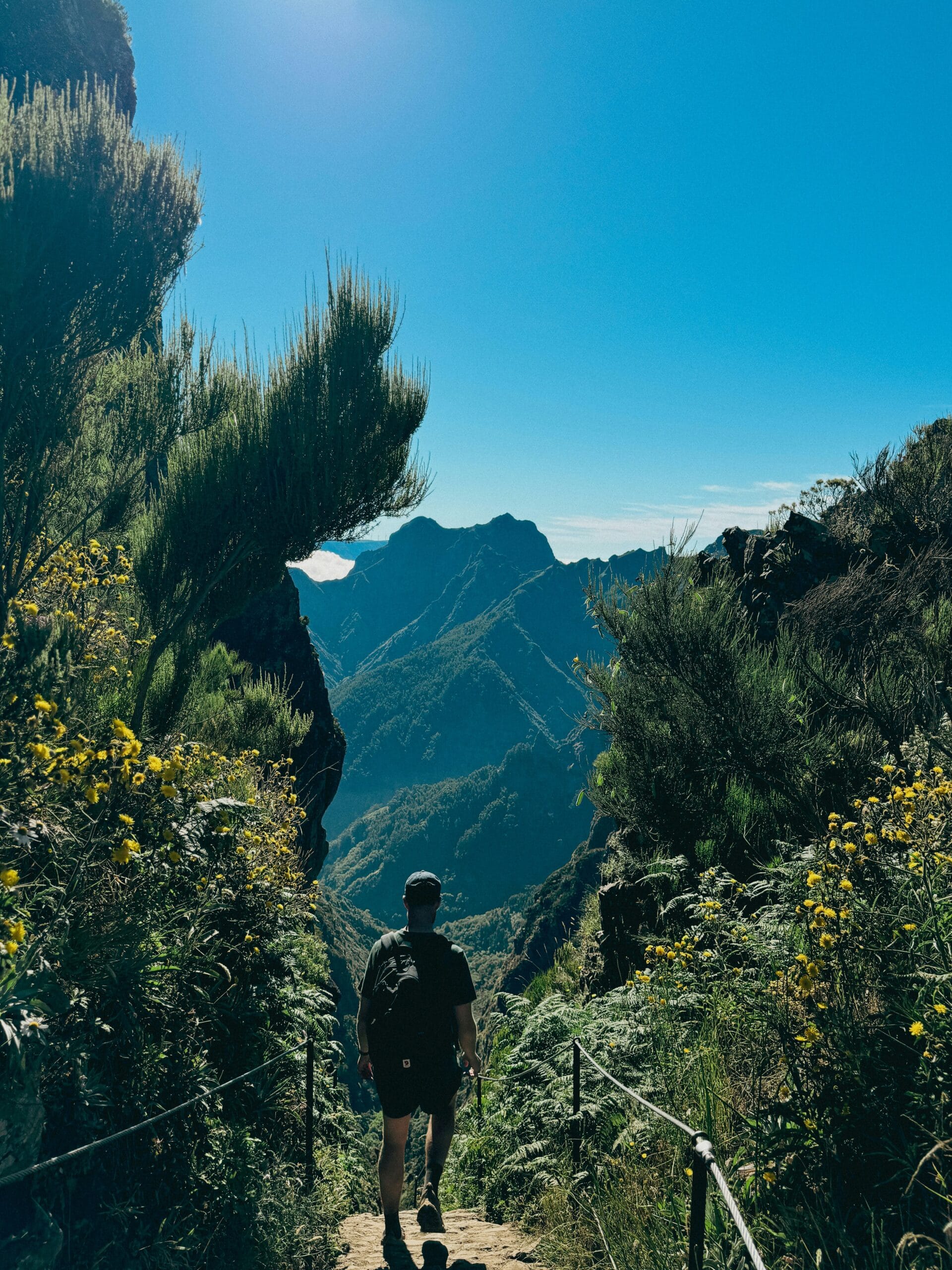 Hiker on a dramatic mountain trail in Madeira